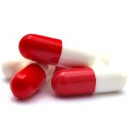 Macro of red and white tablets isolated on white